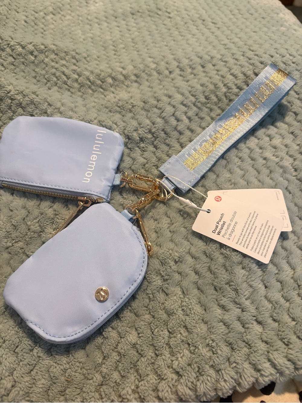 lululemon athletica light blue wristlet pouch with gold hardware